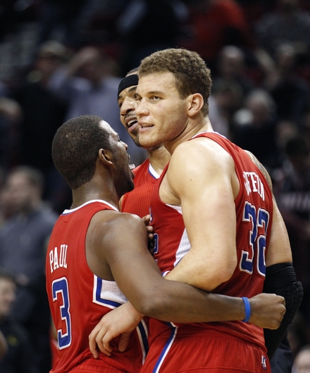 Los Angeles Clippers' Blake Griffin (32) , Chris Paul (3) And Kenyon Martin, Rear Celebrate Their 74-71 Victory