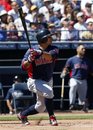 Cleveland Indians ' Shin-Soo Choo follows through on a base hit against the San Diego Padres in the sixth inning of a spring training baseball game Thursday, March 22, 2012, in Peoria, Ariz.