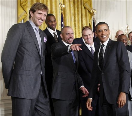 President Barack Obama Watch As Dallas Mavericks Jason Kidd Points To Teammates In The Audience, Monday, Jan., 9, 2012,