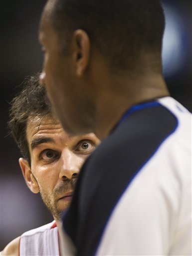 Toronto Raptors Forward Jose Calderon, Left, Looks At Game Official James Capers While Playing Against The San Antonio