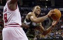 Toronto Raptors ' DeMar DeRozan , right, drives to the net past Chicago Bulls ' Luol Deng during second-half NBA basketball game action in Toronto, Wednesday, March 21, 2012.