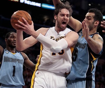 Los Angeles Lakers Forward Pau Gasol, Middle, Grabs A Rebound From Memphis Grizzlies Center Hamed Haddadi, Right, As