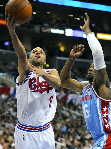 San Antonio Spurs Guard Tony Parker (9), Of France, Gets By Los Angeles Clippers Center DeAndre Jordan (6) For A Basket