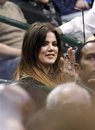 Khloe Kardashian cheers during the second half of an NBA basketball game between the Dallas Mavericks and the Toronto Raptors in Dallas on Friday, Dec. 30, 2011. Dallas won 99-86.