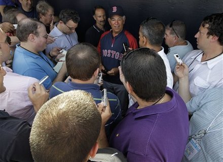 Reporters Gather Around Boston Red Sox Manager Bobby Valentine, Center, In The Red Sox Dugout