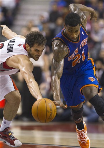 New York Knicks Guard Iman Shumpert, Right, Steals The Ball From Toronto Raptors Guard Jose Calderon For A Breakaway