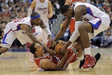 Milwaukee Bucks Point Guard Shaun Livingston, Battles For A Loose Ball With Los Angeles Clippers Point Guard Mo