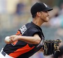 Miami Marlins relief pitcher Steve Cishek throws against the New York Mets in the eighth inning of a spring training baseball game in Jupiter, Fla., Saturday, March 31, 2012. Miami won 6-5.