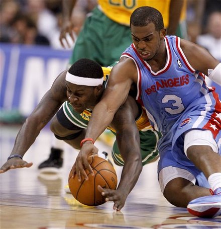 Memphis Grizzlies Guard Josh Selby, Left, And Los Angeles Clippers Guard Chris Paul Dive For A Loose Ball