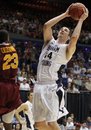 Brigham Young forward Noah Hartsock (34) shoots against Iona forward Randy Dezouvre (23) in the second half of an NCAA First Four college basketball tournament game, Tuesday, March 13, 2012, in Dayton, Ohio . Hartsock led Brigham Young to a 78-72 win with 23 points.