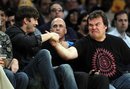 Ashton Kutcher, left, shakes hands with Jack Black over Dreamworks Animation CEO Jeffrey Katzenberg, center, during the first half of an NBA basketball game between the New Jersey Nets and the Los Angeles Lakers in Los Angeles, Tuesday, April 3, 2012.