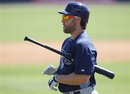 Tampa Bay Rays designated hitter Luke Scott walks back the dugout after striking out to end the first inning of a spring training baseball game against the Baltimore Orioles in Sarasota, Fla., Tuesday, March 13, 2012.