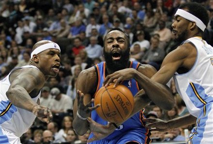 Oklahoma City Thunder Guard James Harden, Center, Is Fouled By Denver Nuggets Forward Corey Brewer, Right, With Al