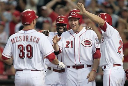 Cincinnati Reds' Devin Mesoraco (39) Is Greeted At Home By, Left To Right, Brandon Phillips, Todd Frazier, And Chris