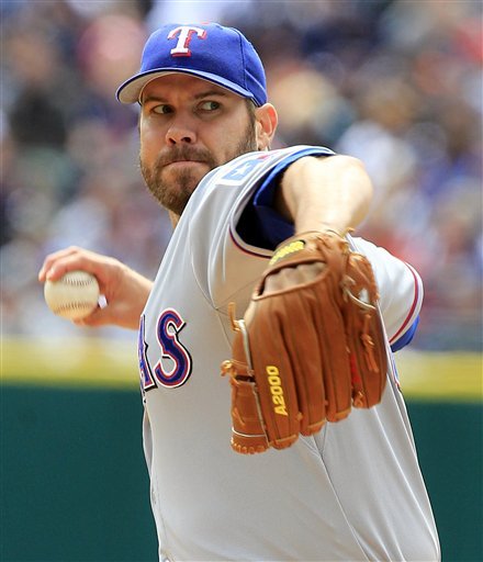 Texas Rangers Starting Pitcher Colby Lewis Throws