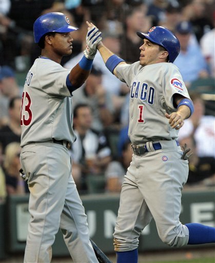 Chicago Cubs' Starlin Castro, Left, High-fives Tony Campana