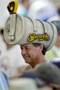 A Milwaukee Brewers fan wears a hat during a spring training baseball game against the San Francisco Giants , Sunday, March 4, 2012, in Phoenix.