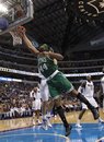 Boston Celtics forward Chris Wilcox (44) shoots a layup as Dallas Mavericks forward Dirk Nowitzki defends during the first half of an NBA basketball game in Dallas, Monday, Feb. 20, 2012. Dallas won 89-73.