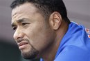 New York Mets starting pitcher Johan Santana looks on from the dugout during a spring training baseball game against the St. Louis Cardinals in Jupiter, Fla., Wednesday, March 21, 2012. St. Louis won 2-1.