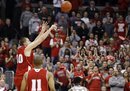 Wisconsin's Jared Berggren, left, shoots a 3-pointer against Ohio State during the second half of an NCAA college basketball game, Sunday, Feb. 26, 2012, in Columbus, Ohio. Wisconsin won 63-60.