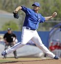 Toronto Blue Jays starting pitcher Brett Cecil winds up in the first inning of a spring training baseball game against the Philadelphia Phillies in Dunedin, Fla., Sunday, March 18, 2012. Toronto won 10-2.