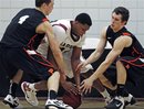 Harvard forward Keith Wright, center, tries to regain possession against Princeton forward Denton Koon, left, and guard Jimmy Sherburne during the first half of an NCAA college basketball game in Cambridge, Mass., Friday Feb. 24, 2012.