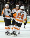 Philadelphia Flyers ' Andrej Meszaros , left, is congratulated by Matt Carle and Matt Read (24) after scoring against the New York Rangers in the third period of an NHL hockey game at New York's Madison Square Garden, Friday, Dec. 23, 2011. The Rangers won 4-2.