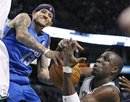 Boston Celtics forward Mickael Pietrus , right, grabs the ball as Dallas Mavericks guard Delonte West (13) tries to drive to the basket during the second half of an NBA basketball game in Boston, Wednesday, Jan. 11, 2012. Dallas won 90-85.