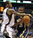 Milwaukee Bucks ' Monta Ellis left, knocks the ball away from Indiana Pacers ' Leandro Barbosa (28) during the second half of an NBA basketball game on Saturday, March 24, 2012, in Milwaukee. The Pacers defeated the Bucks 125-104.