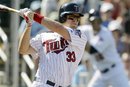 Minnesota Twins ' Justin Morneau bats during the fifth inning of a spring training baseball game against the Tampa Bay Rays , Saturday, March 3, 2012, in Fort Myers, Fla. Minnesota won 7-3.