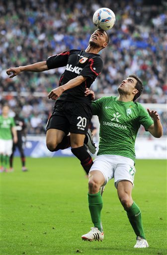 Augsburg's Marcel Ndjeng , Left, Challenges