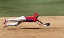 Philadelphia Phillies third baseman Pete Orr dives but cannot reach a ground ball single hit by Houston Astros ' J.D. Martinez in the sixth inning of a spring training baseball game in Kissimmee, Fla., Tuesday, March 13, 2012.