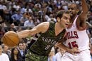 Toronto Raptors ' Jose Calderon , left, drives to the net past Chicago Bulls ' John Lucas III during second-half NBA basketball game action in Toronto, Wednesday, March 21, 2012.