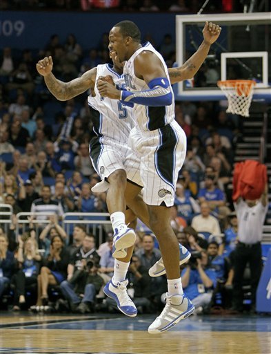 Orlando Magic's Dwight Howard, Front, And Quentin Richardson Bump Chests