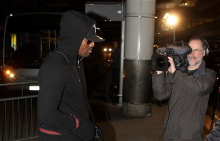 British Boxer Dereck Chisora, Left, Arrives Back At Heathrow Airport In London Sunday, Feb. 19, 2012 Following His WBC