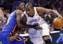 Oklahoma City Thunder forward Kevin Durant , right, drives around New York Knicks guard Bill Walker , left, in the third quarter of an NBA basketball game in Oklahoma City, Saturday, Jan. 14, 2012. The Thunder won 104-92.