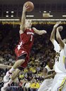 Wisconsin guard Ben Brust, left, drives to the basket over Iowa forward Darius Stokes during the second half of an NCAA college basketball game, Thursday, Feb. 23, 2012, in Iowa City, Iowa. Iowa won 67-66.