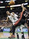 Boston Celtics point guard Rajon Rondo (9) passes the ball after driving against Miami Heat power forward Udonis Haslem (40) in the second half of an NBA basketball game in Boston, Sunday, April 1, 2012. Rondo had a triple-double as the Celtics won 91-72.