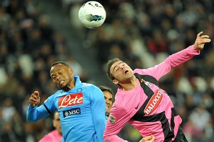 Juventus' Defender Andrea Barzagli, Right, Jump For The Ball With Napoli' Juan Zuniga Of Colombia