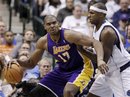 Los Angeles Lakers center Andrew Bynum (17) fights for position against Dallas Mavericks ' Brendan Haywood , right, in the second half of an NBA basketball game Wednesday, Feb. 22, 2012, in Dallas. The Lakers won 96-91.