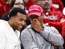 Former Wisconsin football players Nick Toon, left, and Russell Wilson talk on the sidelines during the second half of an NCAA college basketball game between Wisconsin and Minnesota on Tuesday, Feb. 28, 2012, in Madison, Wis. Both took part in the NFL combine in Indianapolis.
