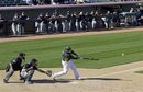 Oakland Athletics ' Landon Powell gets a hit during the ninth inning of a spring training baseball game against the Seattle Mariners , Friday, March 2, 2012, in Phoenix. John Jaso catches for Seattle.