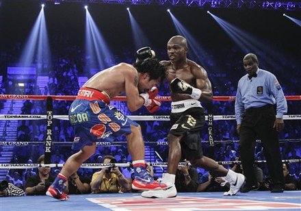 Manny Pacquiao, Left, And Timothy Bradley Exchange Punches
