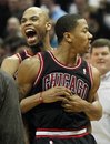 Chicago Bulls ' Derrick Rose , right, and teammate Taj Gibson , react after Rose hit the game-winning shot against the Milwaukee Bucks during the second half of an NBA basketball game Wednesday, March 7, 2012, in Milwaukee. Rose drilled a long jumper at the buzzer, powering the Bulls to a 106-104 victory over the Bucks.