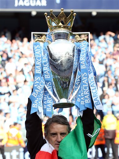 Manchester City's Manager Roberto Mancini Holds