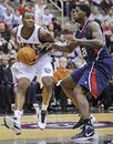 New Jersey Nets ' Damion James , left, drives to the basket as he is guarded by Atlanta Hawks ' Marvin Williams during the second quarter of an NBA basketball game Tuesday, Dec. 27, 2011, in Newark, N.J. The Hawks defeated the Nets 106-70.
