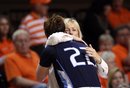 San Diego coach Cindy Fisher hugs senior guard Morgan Woodrow in the final moments against Oklahoma State during a women's NIT college basketball tournament semifinal, Wednesday, March 28, 2012, in Stillwater, Okla. Oklahoma State won 73-57. (AP Photo/Tulsa World, Cory Young) TV OUT TULSA OUT
