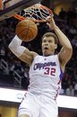 Los Angeles Clippers ' Blake Griffin dunks against the Cleveland Cavaliers in the fourth quarter of an NBA basketball game on Wednesday, Feb. 8, 2012, in Cleveland. Griffin scored 25 points in a 99-92 loss to the Cavaliers.