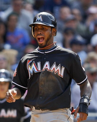 Miami Marlins' Jose Reyes Lets Out A Yell As He Crosses Home Plate With The Go Ahead Run Against The San Diego Padres