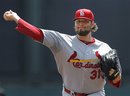 St. Louis Cardinals pitcher Lance Lynn warms up before the first of a spring training baseball game against the Atlanta Braves in Kissimmee, Fla., Monday, March 19, 2012.